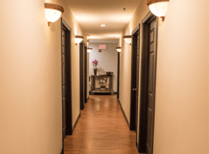 Lighted hallway were the spa rooms are located