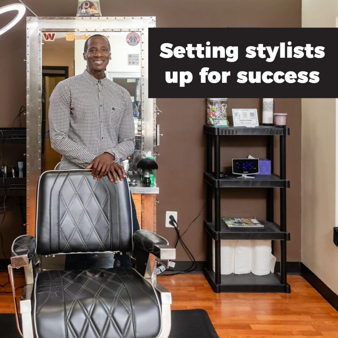 barber in suite standing behind barber chair