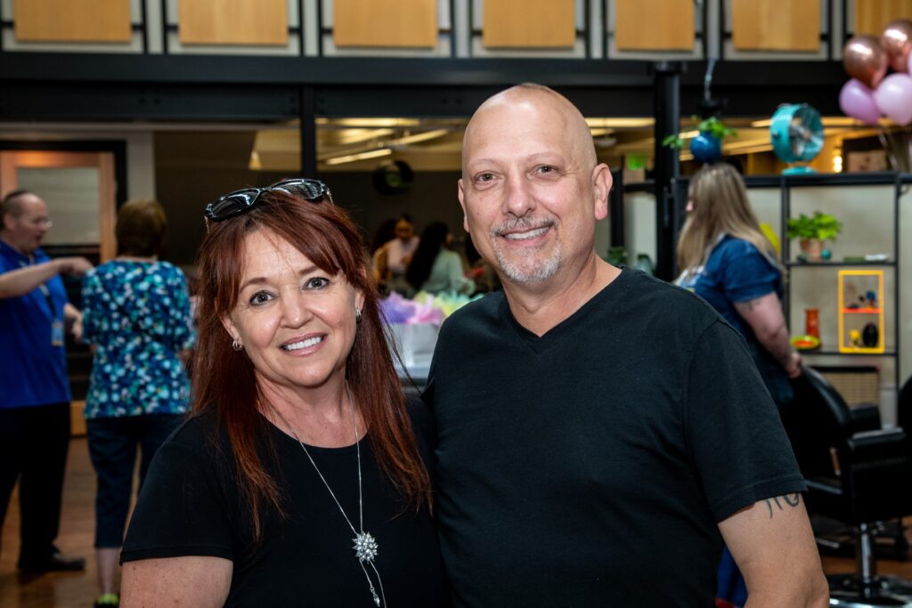 man and a women standing smiling