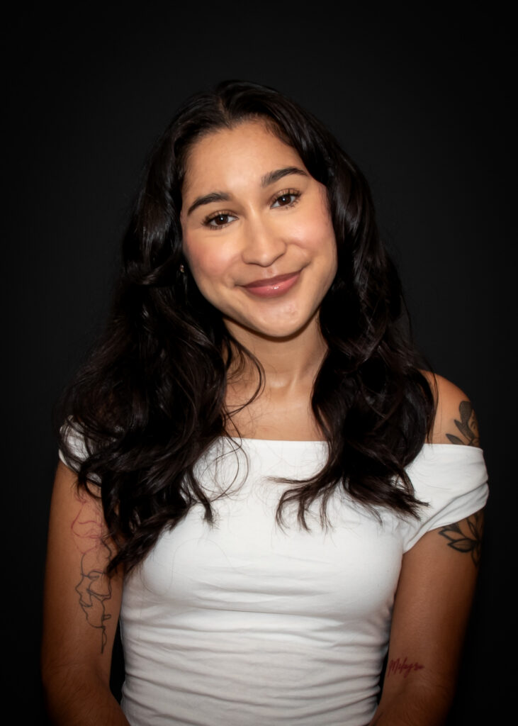 young girl smiling with a white shirt