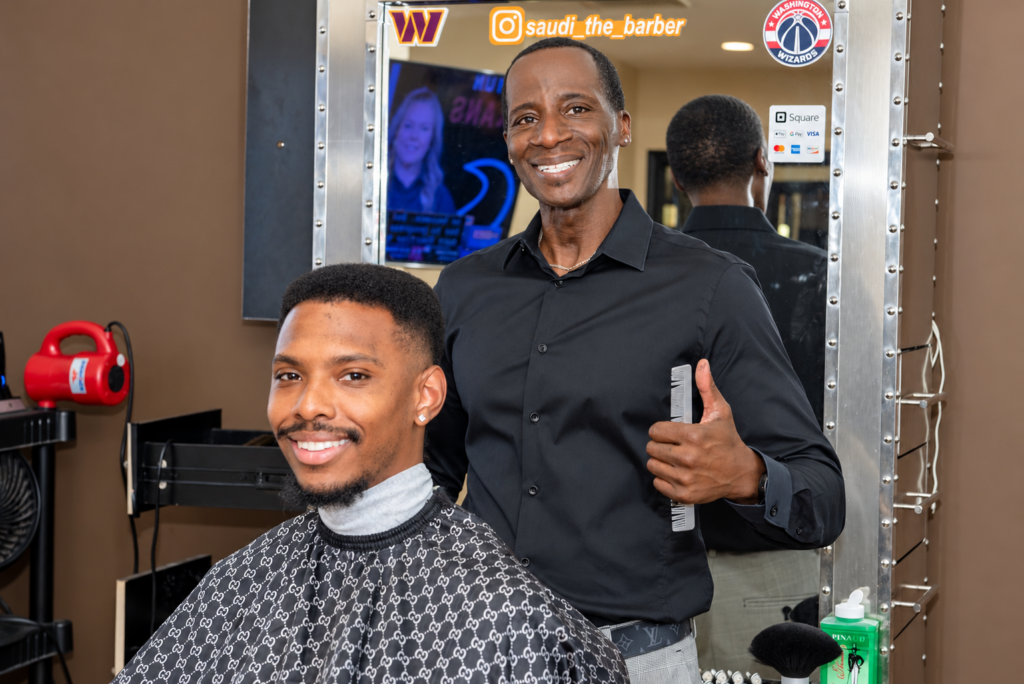 barder smiling with his client